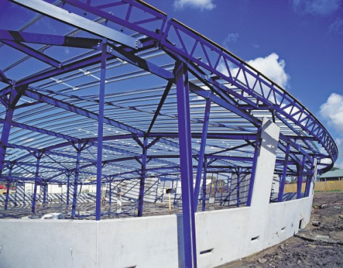 Stramit purlins on the blue structural steel and concrete framework of a building